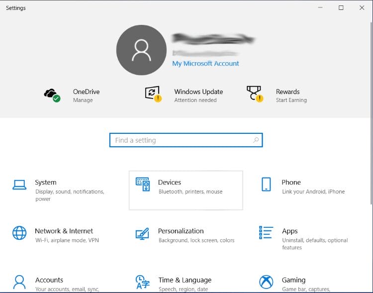 Open your Windows PC and launch Settings. Click Devices.
