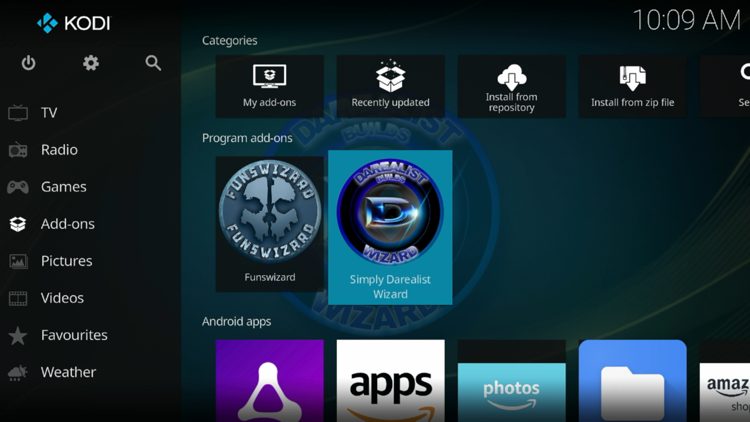 Return back to the home screen of Kodi, hover over Add-ons and click Simply Darealist Wizard under Program add-ons.