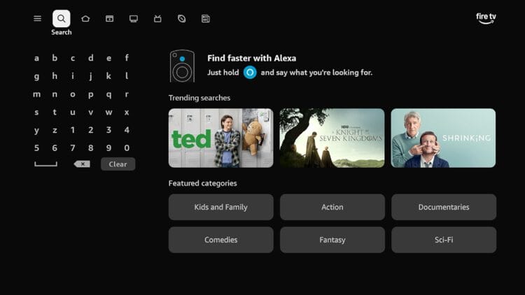 From the home screen of your Fire TV device, hover over the Search button on top.